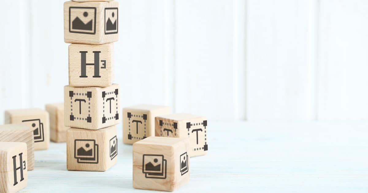 Building blocks stacked on top of each other with Wordpress icons on the faces of the blocks