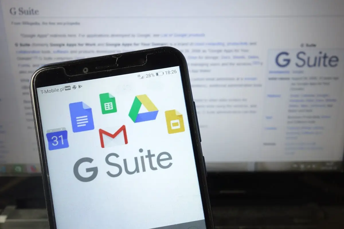 G Suite logo displayed on mobile phone as person tries to learn, "What is G Suite?"