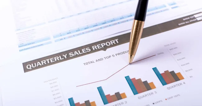 Quarterly sales report colorful bar graph pen drawing increase